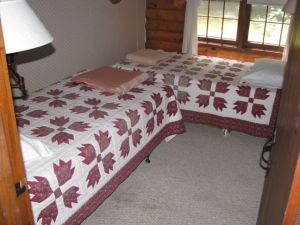 Here is the room BEFORE all the elbow grease went in!!! Peeling 1970's wallpaper with two twin beds practically on top of each other. There was also a bureau in the closet!!!!